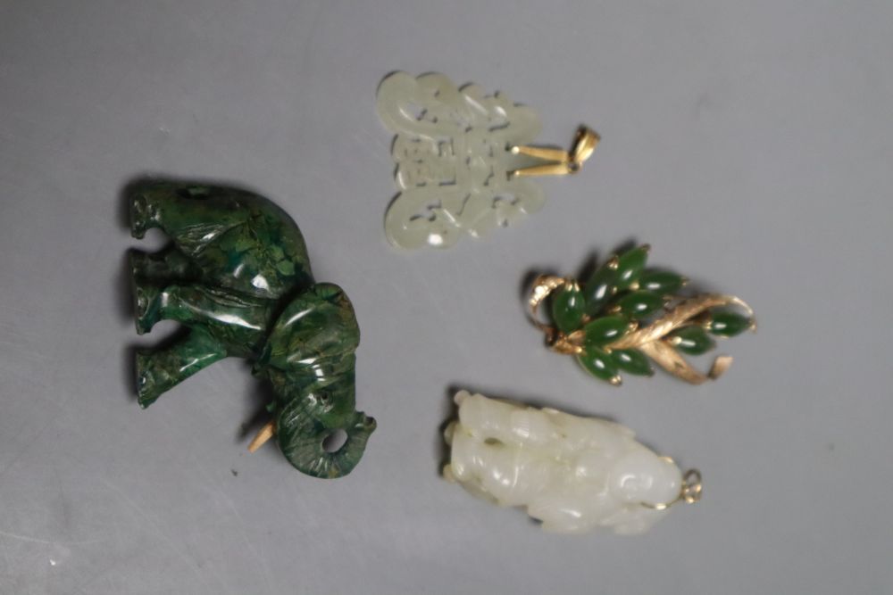 A Chinese pale celadon and russet jade figure of a boy, 4.8cm, a similar carved pendant together with a yellow metal and hardstone set